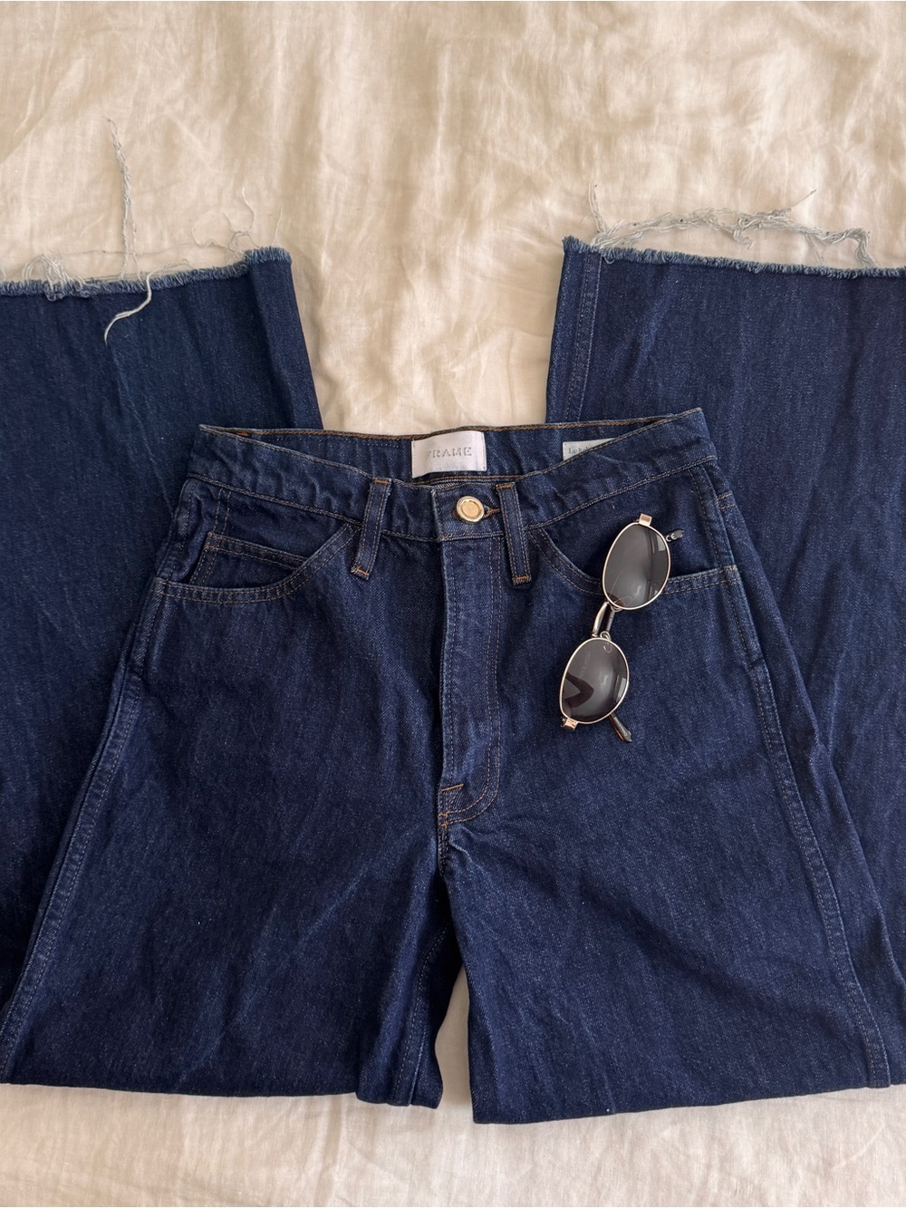 Frame Denim Indigo High-Rise Wide Leg Jeans with Raw Hem